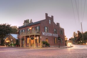 Traditional Western House features a charming balcony and a classic pitched roof.