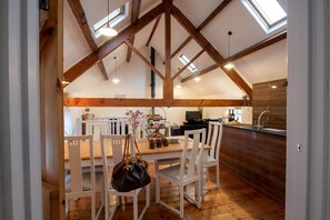 View from the connecting door between Hill Top 1 and Hill Top 2, two-barn group holiday complex sleeping ten in Caergeiliog, Anglesey - Hill Top: 5 bedroom Anglesey holiday barn conversion (Caergeiliog)