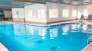 An indoor swimming pool with clear water, surrounded by walls with windows and a ceiling with recessed lighting. - UP TO 50% OFF Lakeside Branson Condo, Incredible view, Pool, Marina (Branson)