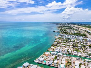 Aerial view - Swept Away  3BR/2BA Keys Retreat with Pool, Dock & Stunning Open Water Views (Marathon)