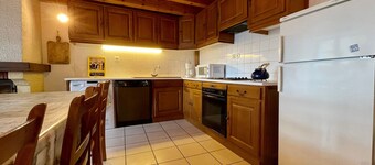 Charming Cottage: 4 Bedrooms, Fireplace, Enclosed Courtyard & Garage in Tranquil Village