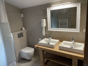 Bathtub, hair dryer, towels, soap