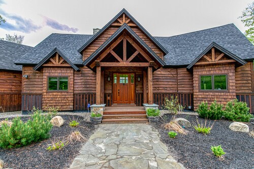 Elegant mountain-view home with private hot tub, saltwater pool & foosball