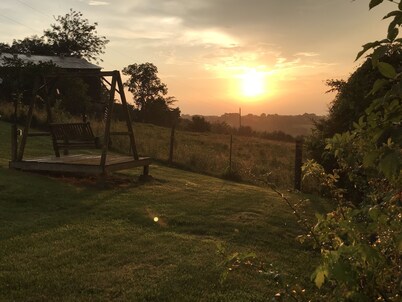 Hilltop Farmhouse with sunrise sunset porch overlooking hills and holler