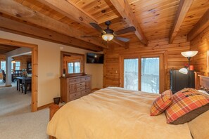 Relax in this inviting bedroom with a comfortable bed, dresser, and TV.