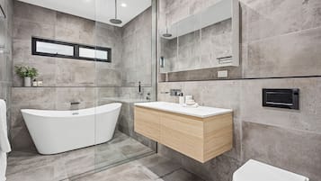 Bathtub, hair dryer, towels, soap