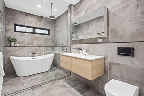 Bathtub, hair dryer, towels, soap