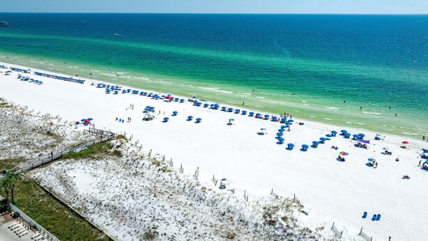A beach with rows of blue umbrellas and white sand. - Azure 110 walkout closest unit to beach access, no Elevator Rides! Beach Service (Fort Walton Beach)