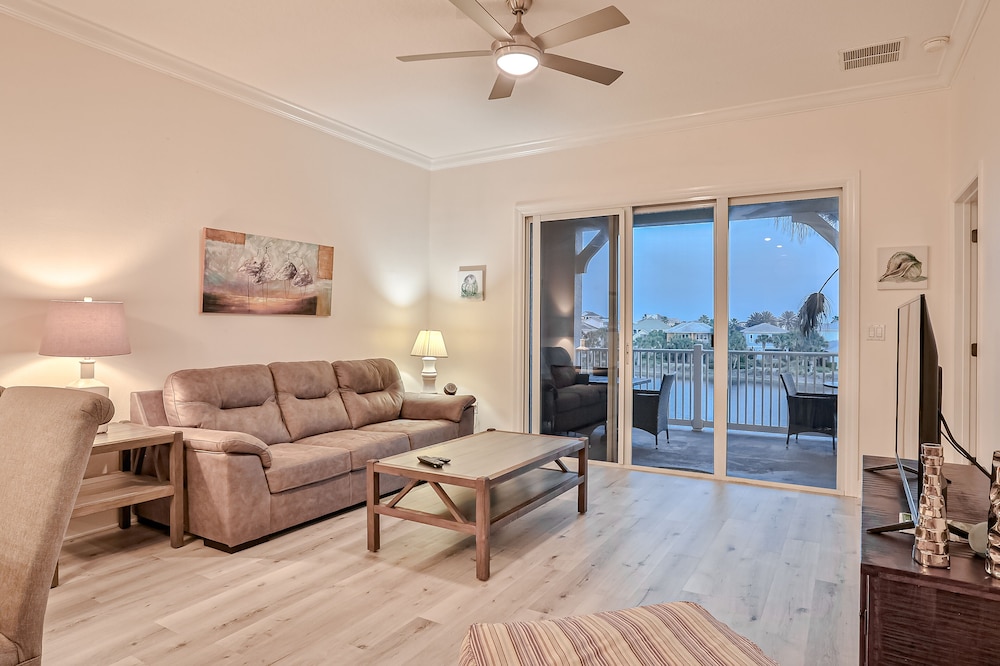 Elegant waterfront condo with central AC, balcony, and shared pools & hot tubs!