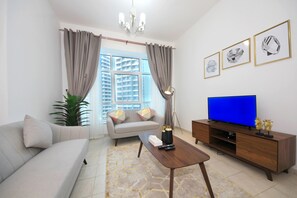 Apartemen Eksekutif, 2 kamar tidur | Ruang keluarga | TV layar datar