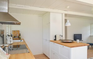 Fridge, stovetop, dishwasher, coffee/tea maker