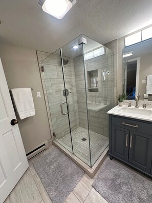 Combined shower/tub, hair dryer, towels, soap