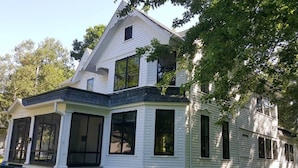 A two-story house with a wrap-around porch and a gabled roof. - Close to Downtown & UWEC (Eau Claire)