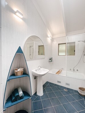 Combined shower/tub, hair dryer, towels, soap