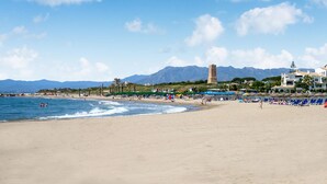 A beach with a clear sky, a sandy shore, and a mountain in the background. - 2 bedroom awesome apartment in Marbella (Marbella)