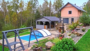 A house with a swimming pool, a covered patio, and a stone exterior. - Nebahovy u Prachatic by Interhome (Prachatice)