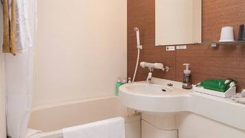 Combined shower/tub, free toiletries, hair dryer, slippers