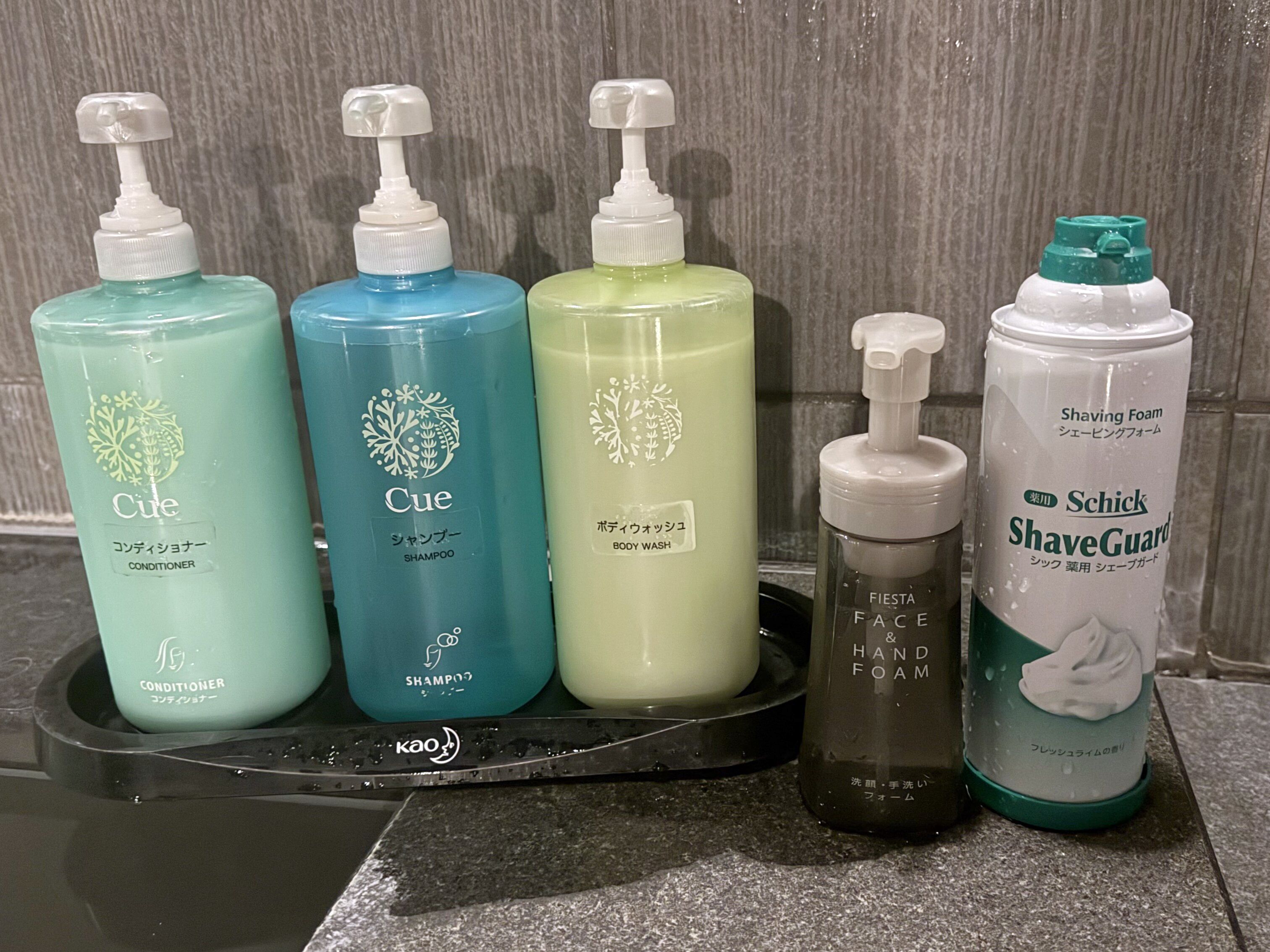 A set of personal care products on a black tray.