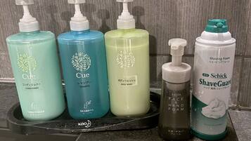 A set of personal care products on a black tray.