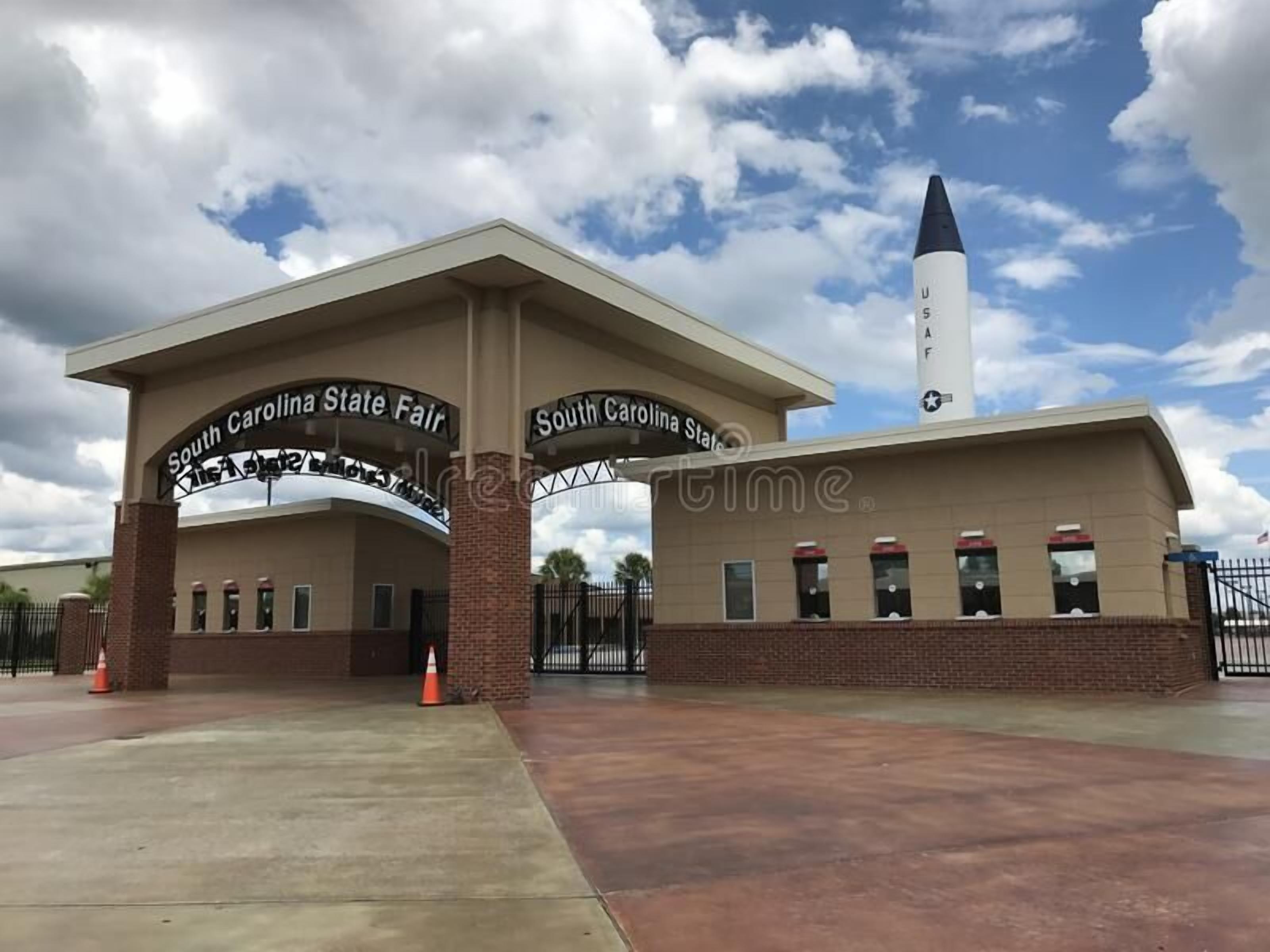 The entrance to South Carolina State Fair with a large archway and a tall flagpole.