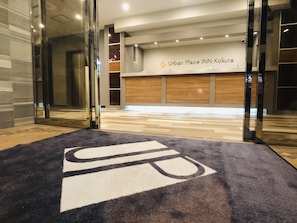 An entrance to a hotel with a sign reading "Urban Place INN Kokura". - Urban Place Inn Kokura (Kitakyushu)
