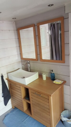 Shower, hair dryer, soap, toilet paper