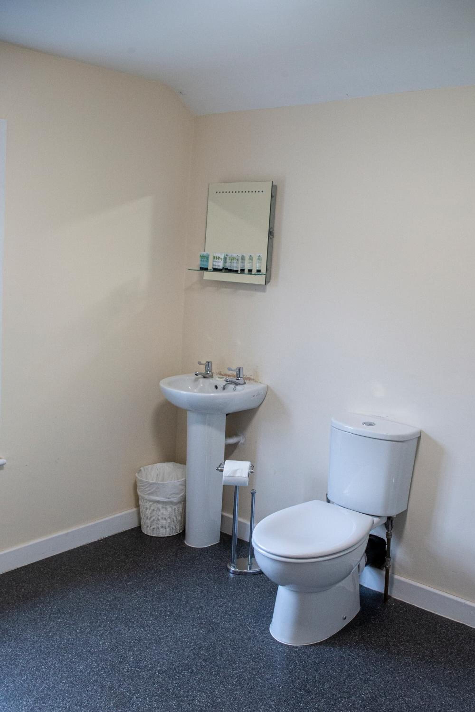 designer toiletries, hair dryer, towels, soap