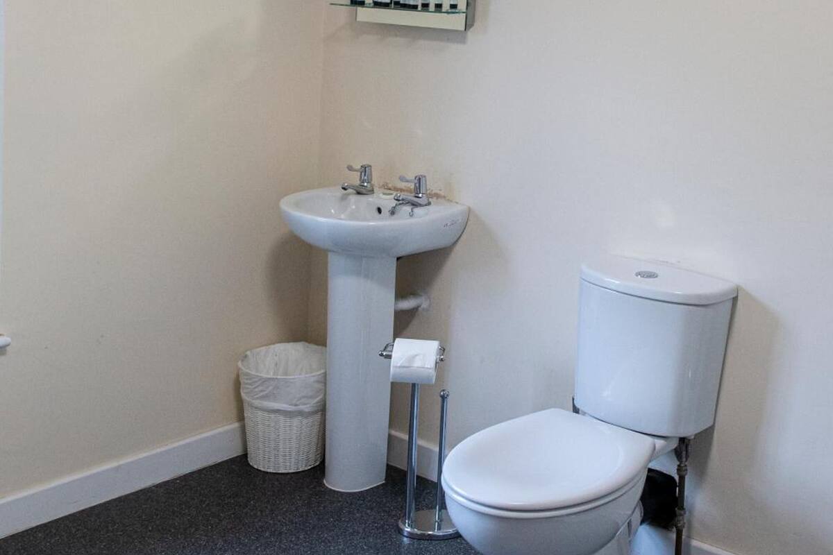 designer toiletries, hair dryer, towels, soap