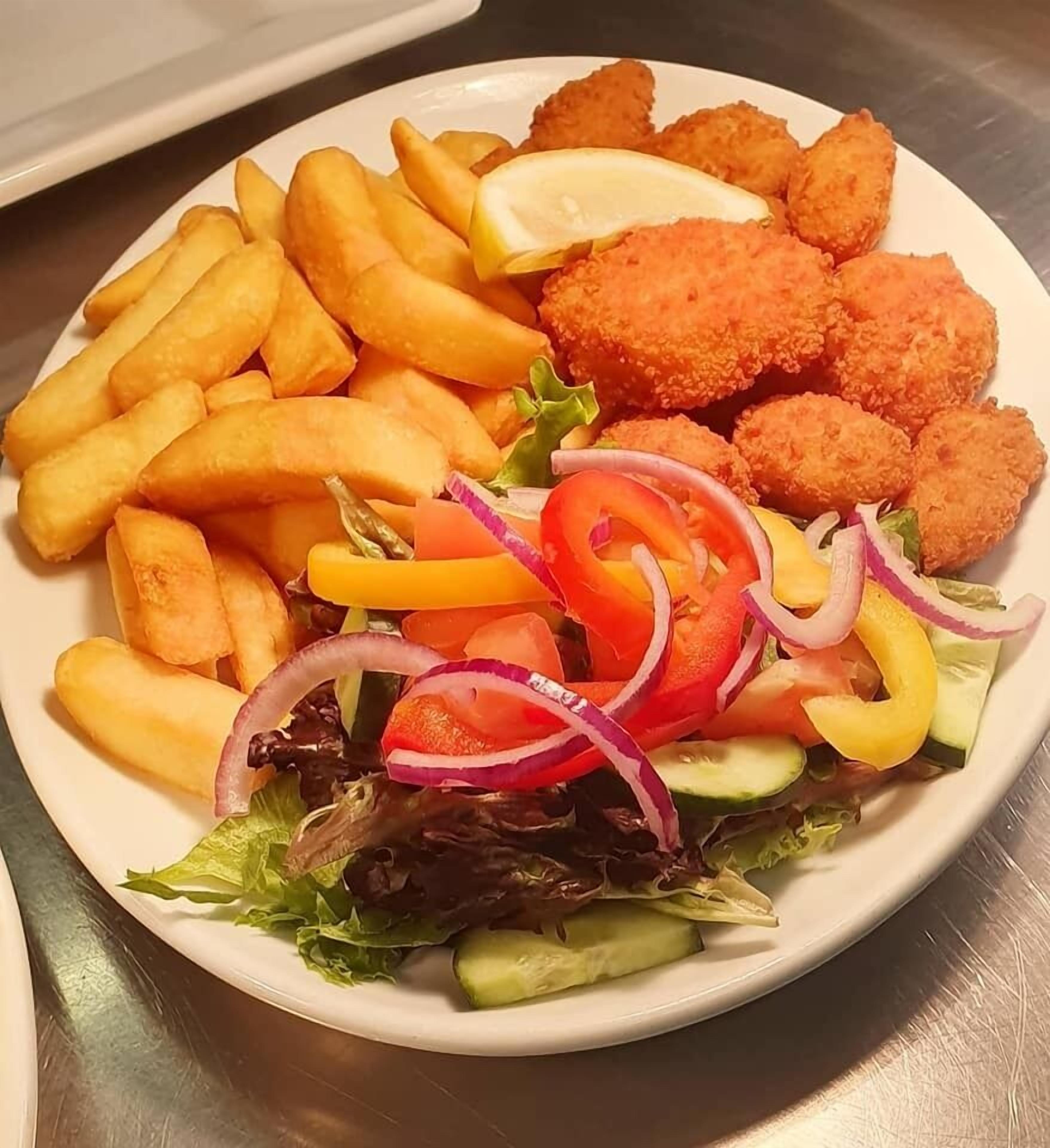 A plate of food with fries, breaded items, and a salad.