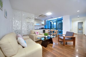 Romantic Apartment | Living area | 35-inch LCD TV with cable channels, TV