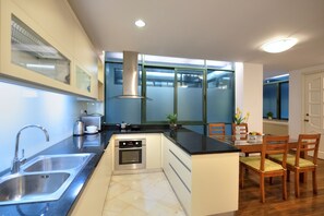 Family Apartment | Private kitchen | Fridge, microwave, stovetop, electric kettle - Lakewood House (Hanoi)
