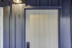 A door with a number '8' and a light fixture above it.