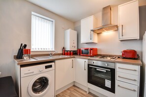 Apartment | Private kitchen | Full-size fridge, microwave, oven, stovetop