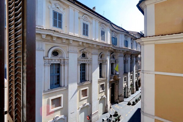 A historic building with classical architecture, featuring multiple windows and a central entrance.