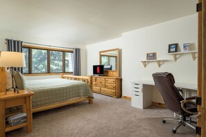 A bedroom with a bed, a desk, a chair, a TV, a dresser, and a window with curtains. - BC/Avon Mtn Gem-3BR/Pool/Hot Tub/Ski Shuttle/Sauna/Gondola Walk! (Avon)