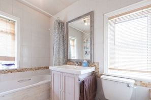 Bathtub, towels, toilet paper