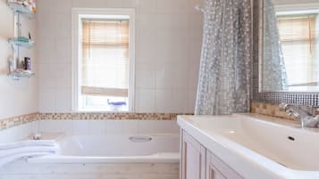 Bathtub, towels, toilet paper