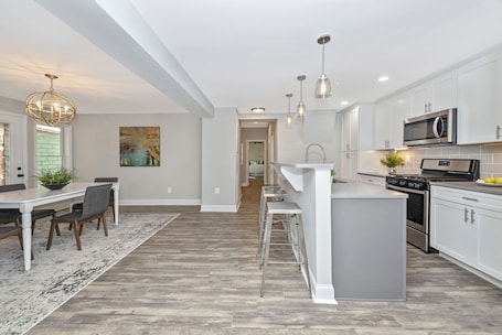 Fridge, microwave, oven, stovetop. Modern Condo Right off Market Street