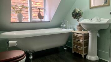 Bathtub, hair dryer, towels, soap