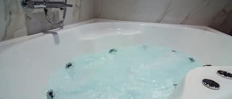 Combined shower/tub, hair dryer, towels, soap