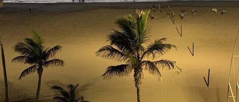 On the beach, sun-loungers