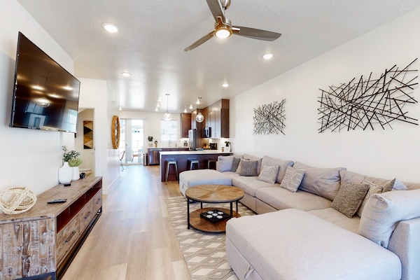 Spacious Living Room with lots of storage and games in TV console.