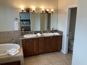 Shower, hair dryer, towels, toilet paper