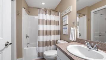 Combined shower/tub, soap, shampoo, toilet paper
