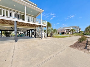 A beachfront hotel with a covered outdoor area, a pool, and a view of the ocean. - Billy-Lisa - Second Row in Garden City Beach, SC (Garden City)