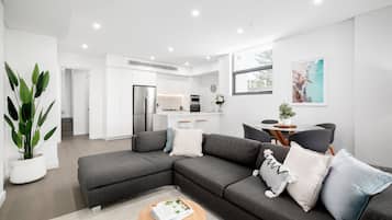 Two Bedroom Penthouse With Parking | Living area | 49-inch Smart TV with digital channels, TV