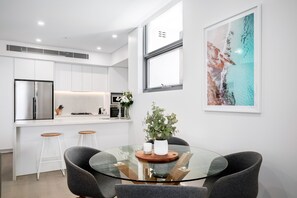 Two Bedroom Penthouse With Parking | Living area | 49-inch Smart TV with digital channels, TV
