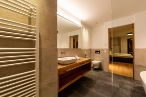Bathtub, hair dryer, towels, soap