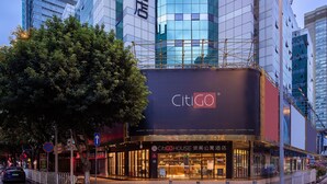 A modern hotel with a prominent 'CitiGO' sign, featuring a glass facade and a distinctive corner design. - CITIGO HOUSE Tianhe Guangzhou (Guangzhou)