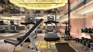A gym with treadmills, weight machines, and dumbbells. - CITIGO HOUSE Tianhe Guangzhou (Guangzhou)
